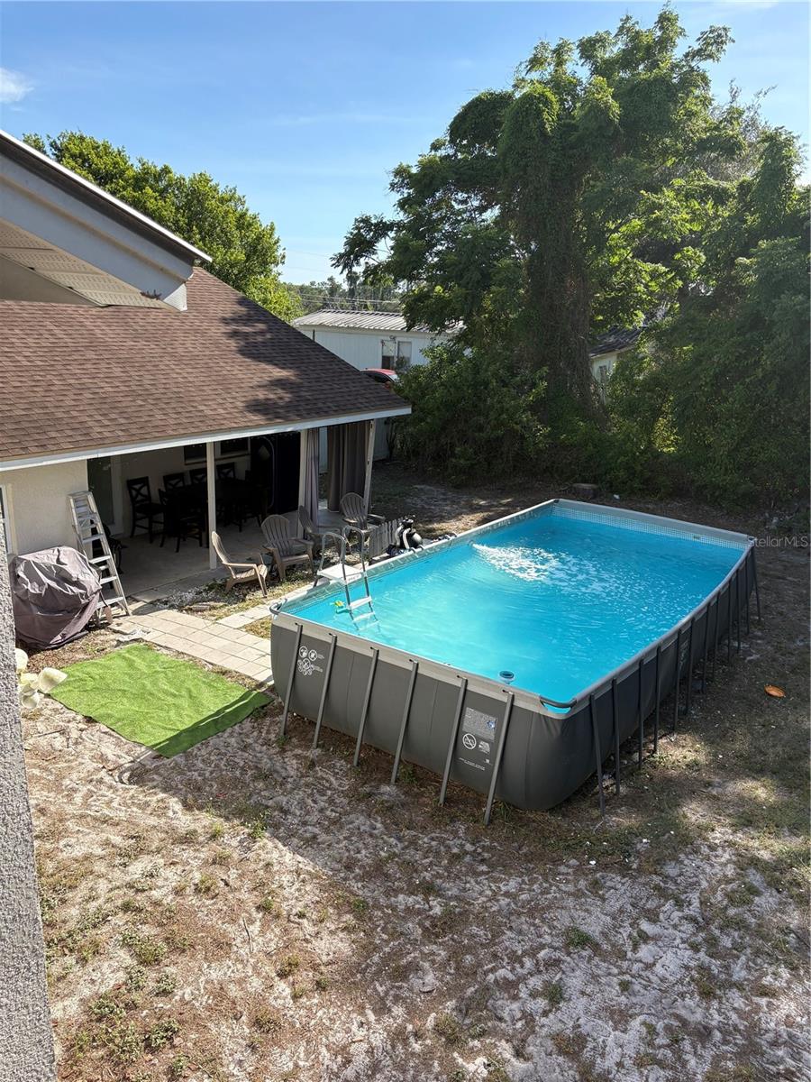 BACK OF HOME AND POOL