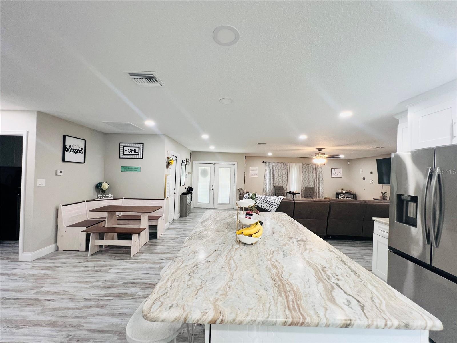 VIEW LOOKING OUT TO DINING AND LIVING AREA