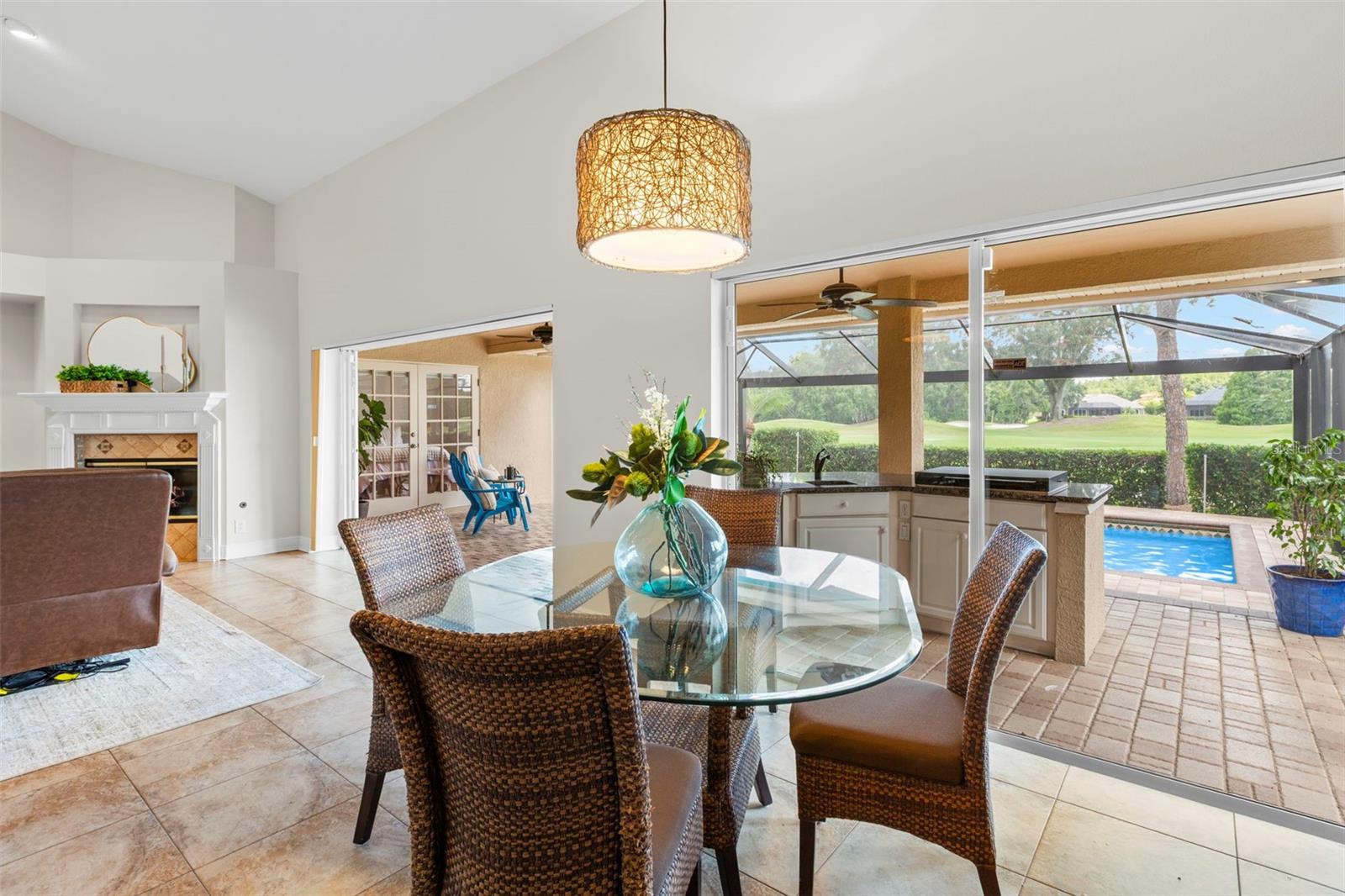 To the right of the kitchen, enjoy the casual dining table, looking at TV or the view.