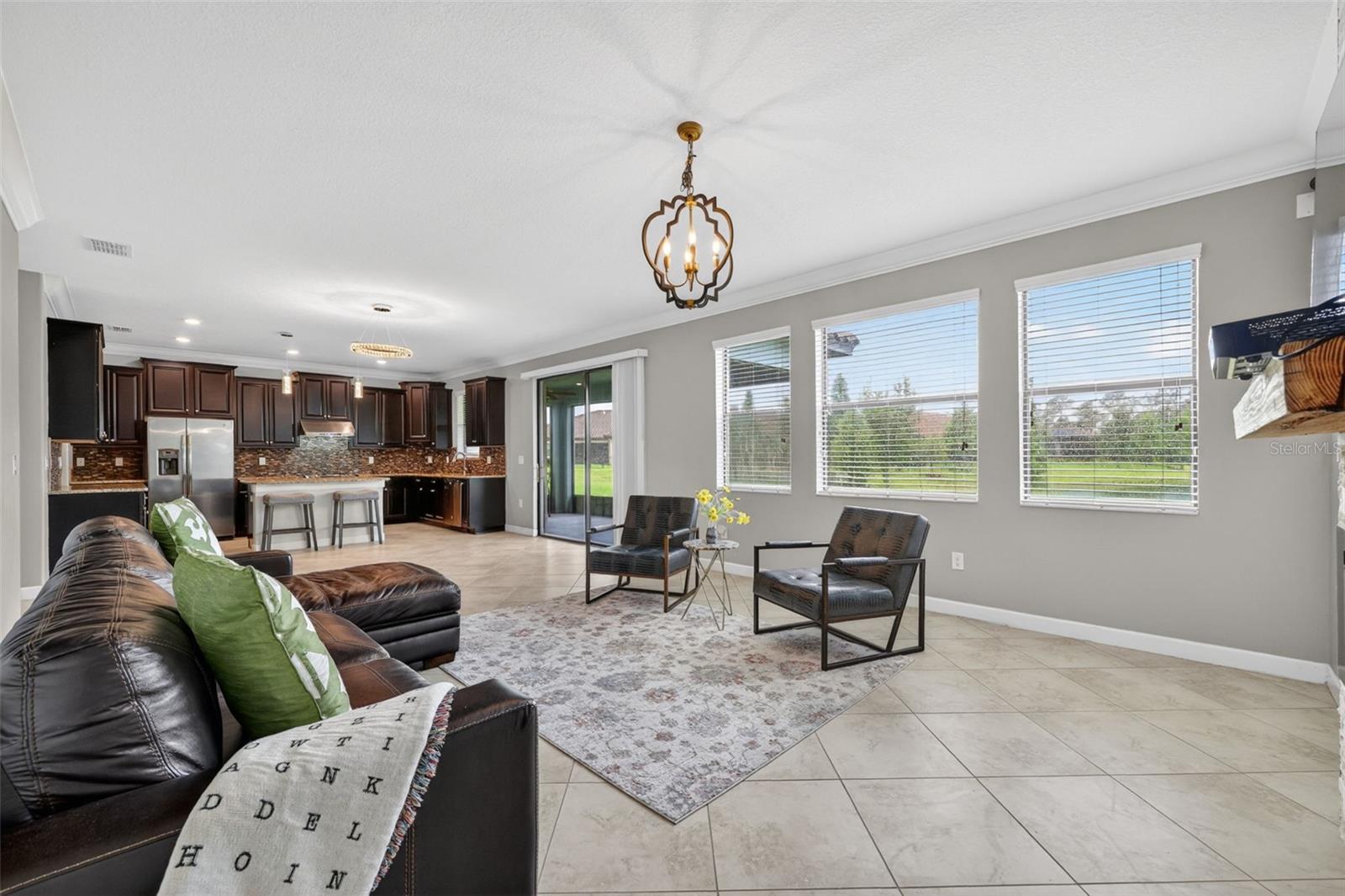 View from Windows to Tranquil Pond and Landscaping. Tons of Natural Light with Windows, Double Glass Sliding Doors, and Window from Kitchen Sink overlooking the landscape.
