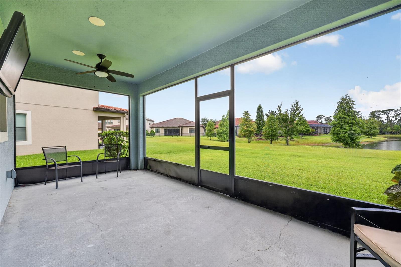 Covered and Screened Lanai with Double Ceiling Fans, Pre-Wired for Speakers and T.V. Large Screen Panels for Gorgeous View of Peaceful Natural Landscape.