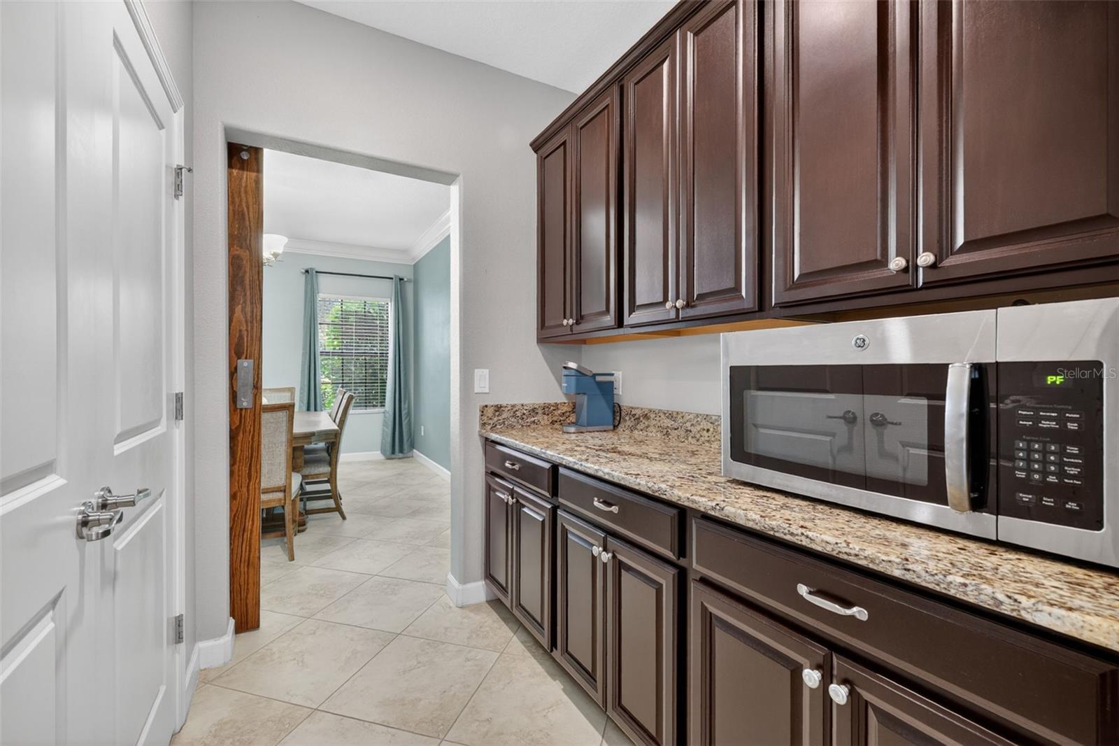 A True Staging Area! An Entertainer's Dream! Butler's Pantry with Barn Door Entry and Access to Kitchen and Flex Room. Double Door Pantry Closet.