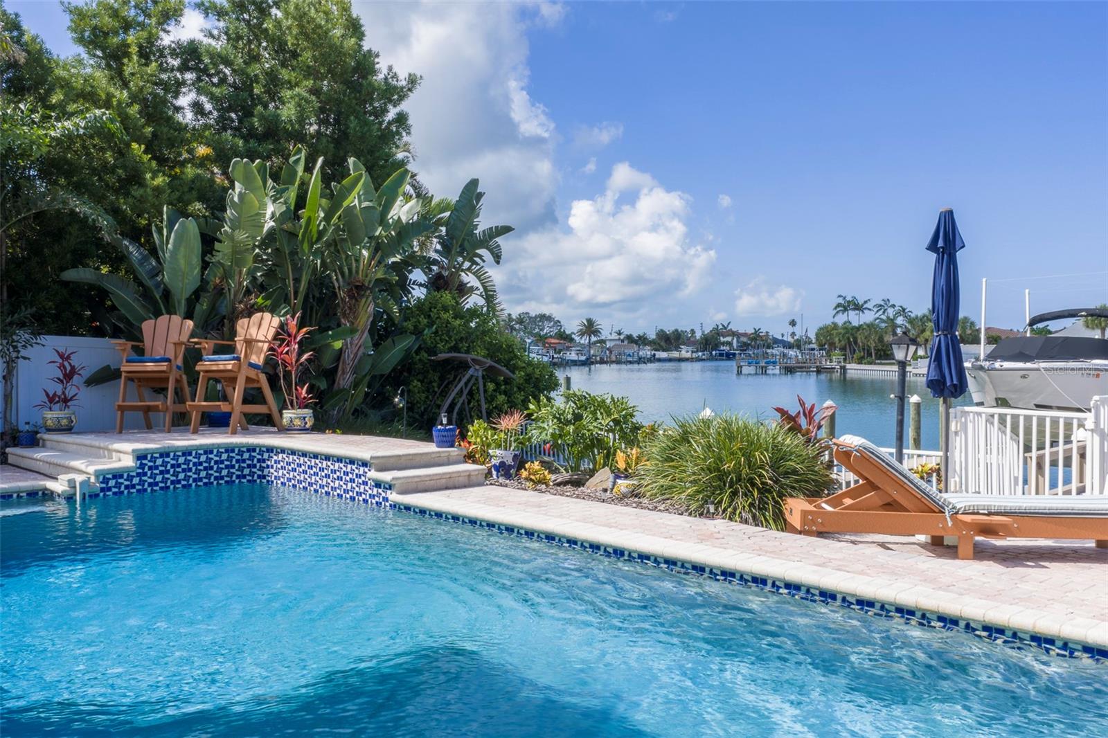 Private back yard - have a dip in the sparkling pool and enjoy the water view