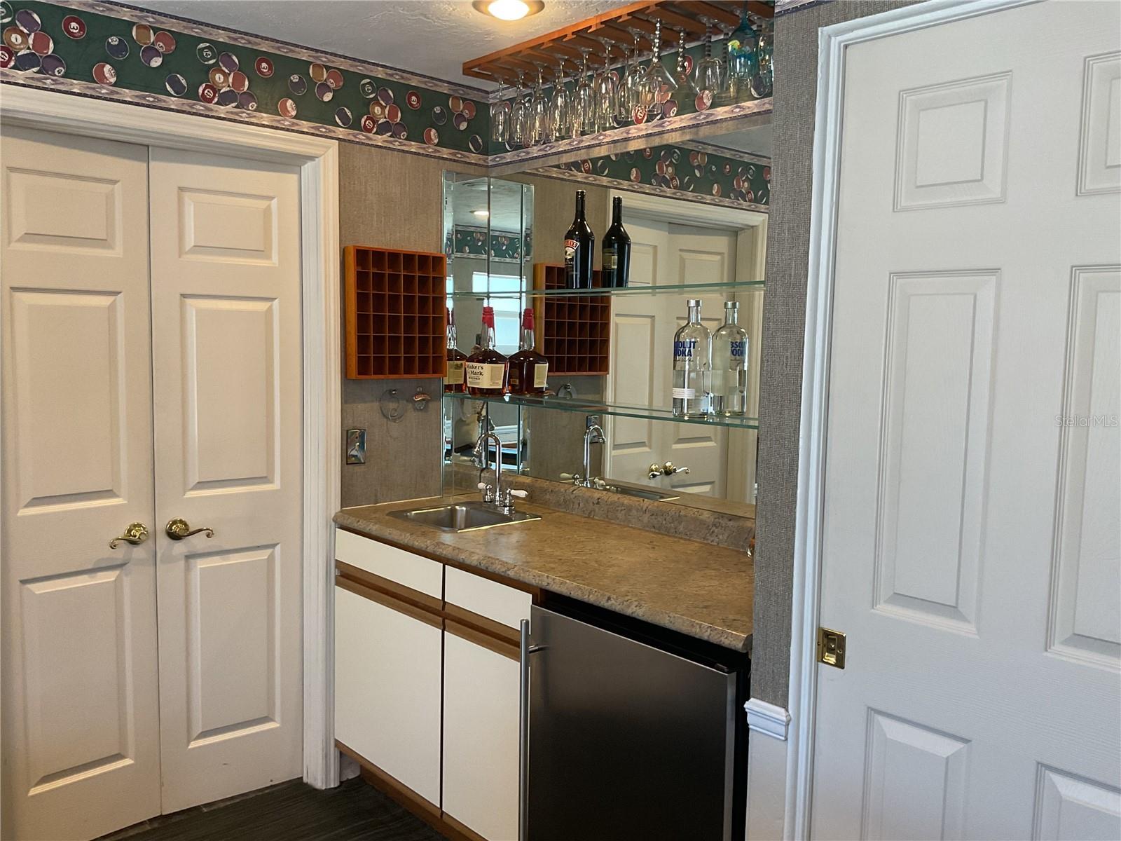 Wet Bar with refrigerator in family/game room - everything you need right at your fingertips