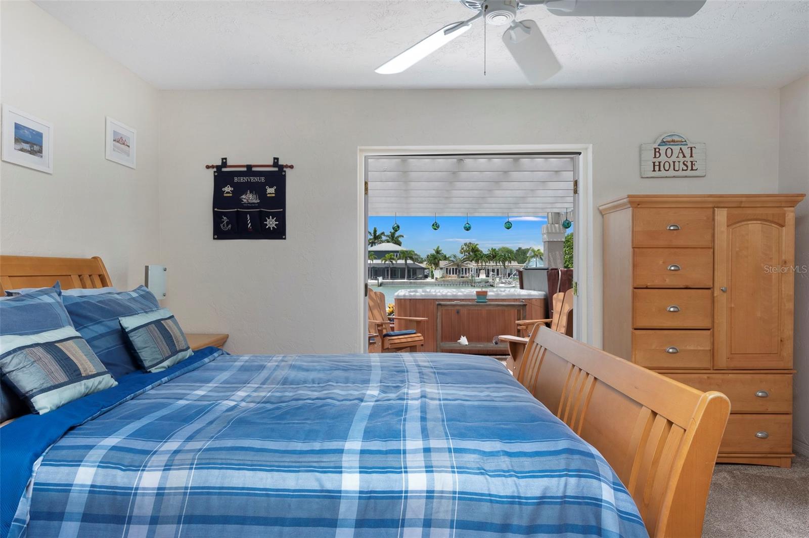 Guest bedroom 1 with French doors leading to hot tub