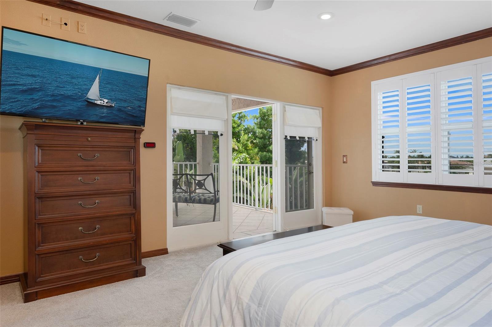 Master bedroom has French doors leading to 2nd floor balcony overlooking the back yard retreat