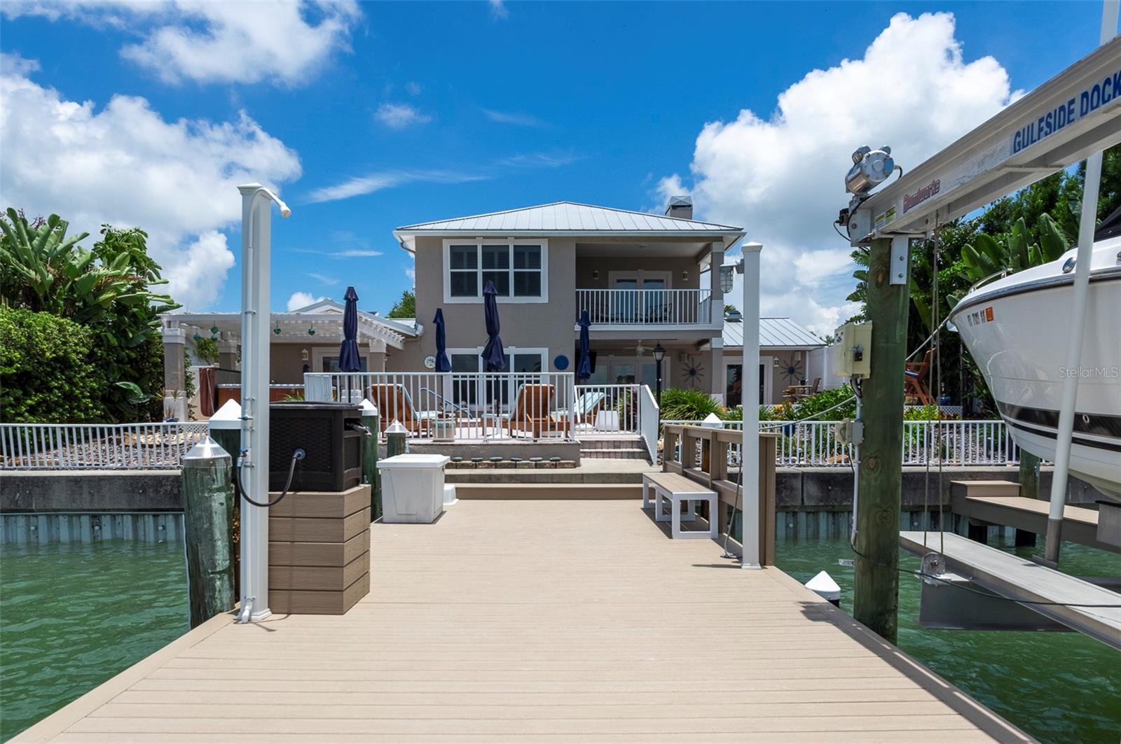 View of house from composite docks with 16,000 lb lift