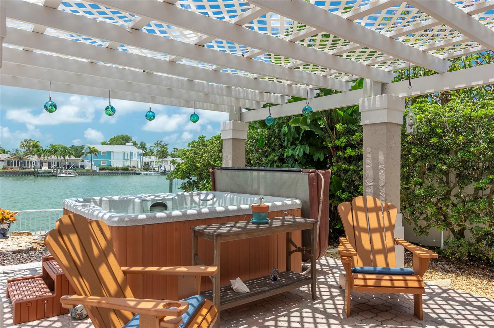 Shady hot tub and seating area