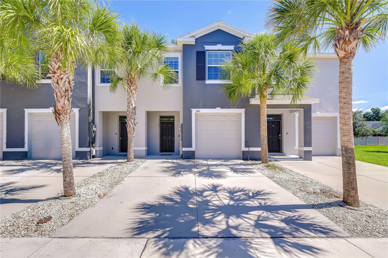 Modern and beautifully maintained townhouse with great curb appeal in the gated District at Bloomingdale.