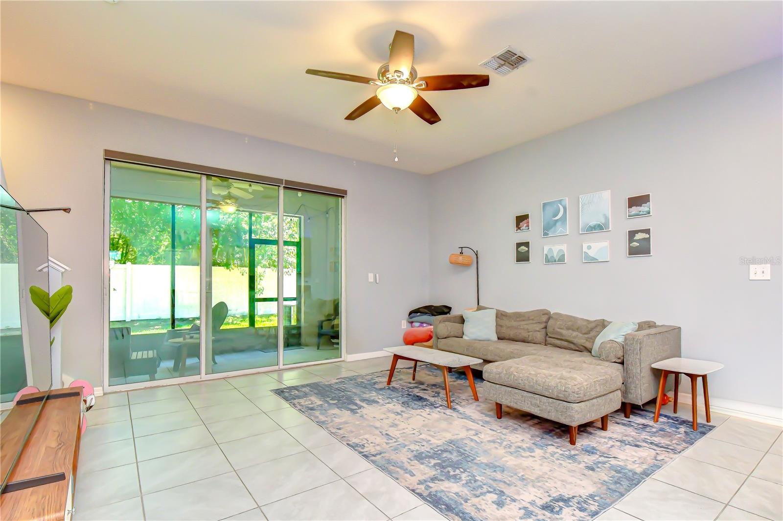 Spacious open-concept main living area featuring easy-care ceramic tile flooring throughout.