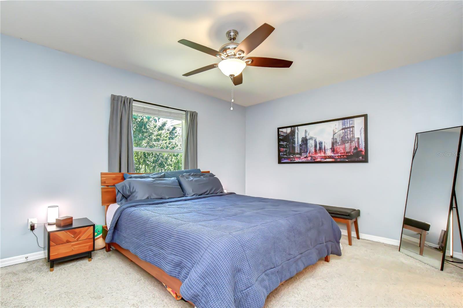 Generously sized upstairs owner's retreat featuring soft carpeting and large windows.