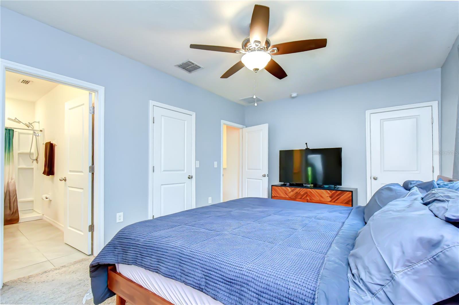 Relaxing primary bedroom layout designed with plenty of space for full bedroom sets.