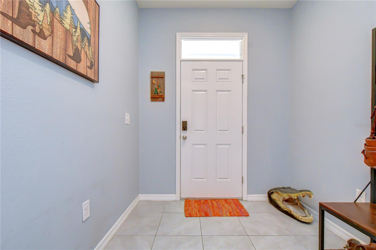 Bright and welcoming foyer entry opening up directly into the main living spaces.
