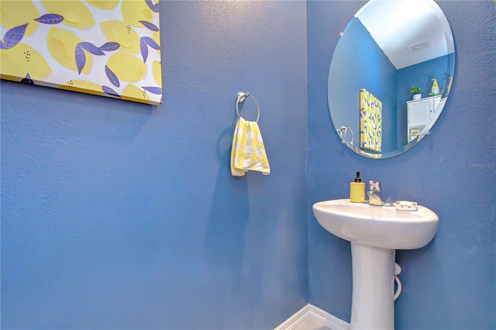 Conveniently located first-floor powder room for guests.