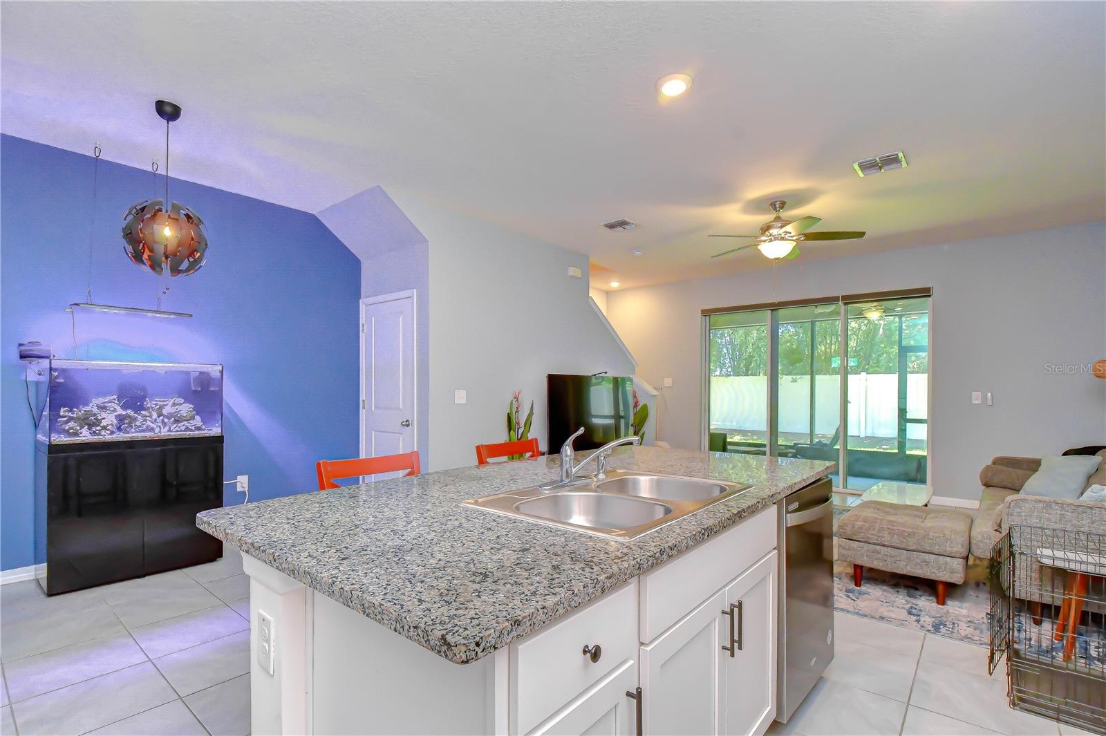 Seamless flow between the kitchen, central island, and everyday dining spaces.