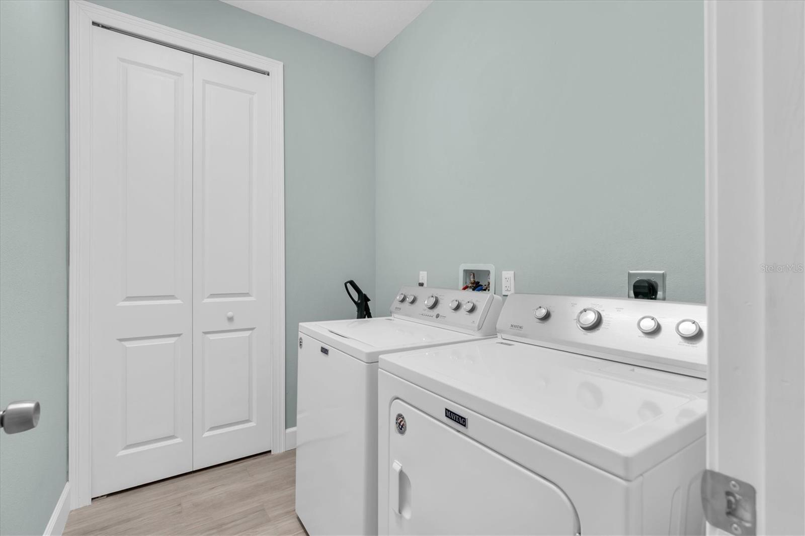 Laundry with storage closet