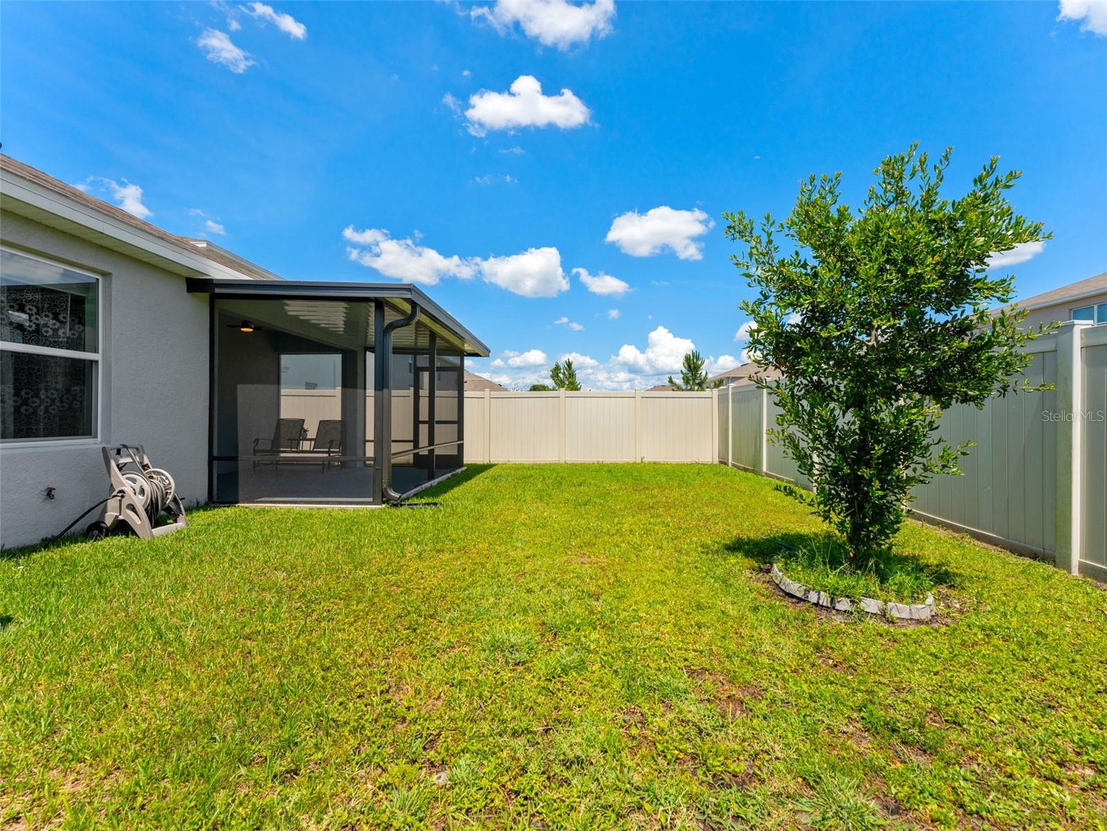 Extended patio, covered and screened in your fully fenced back yard.