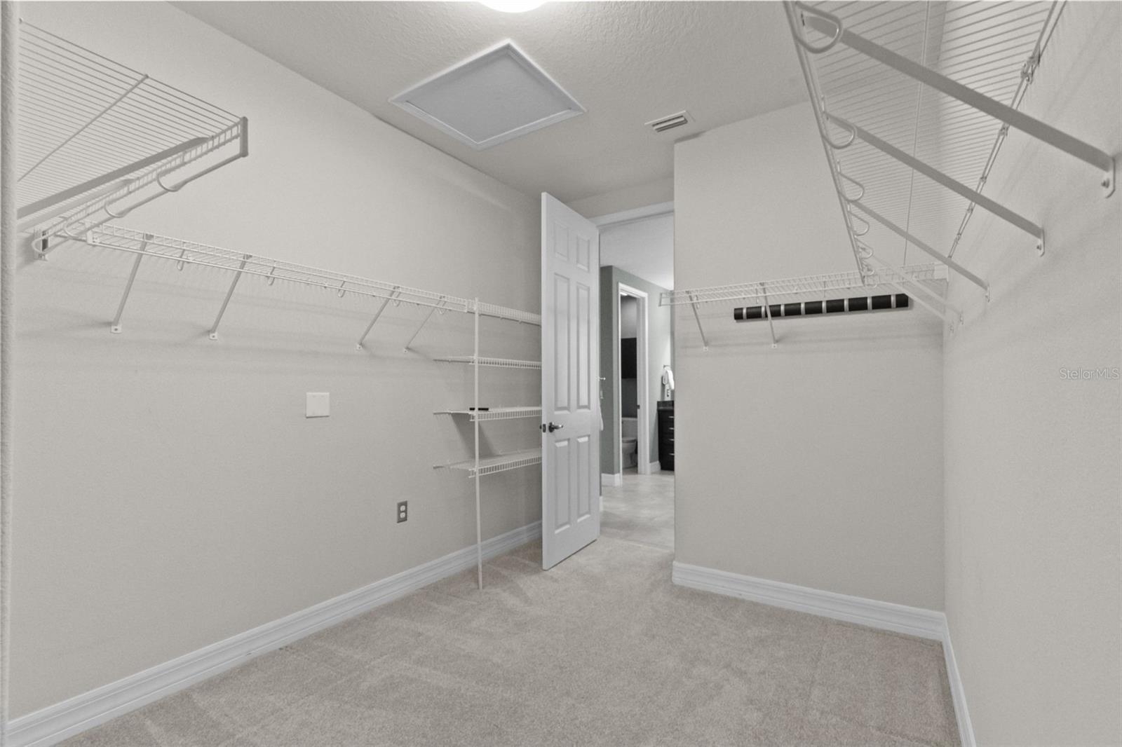 Another view of primary bedroom closet