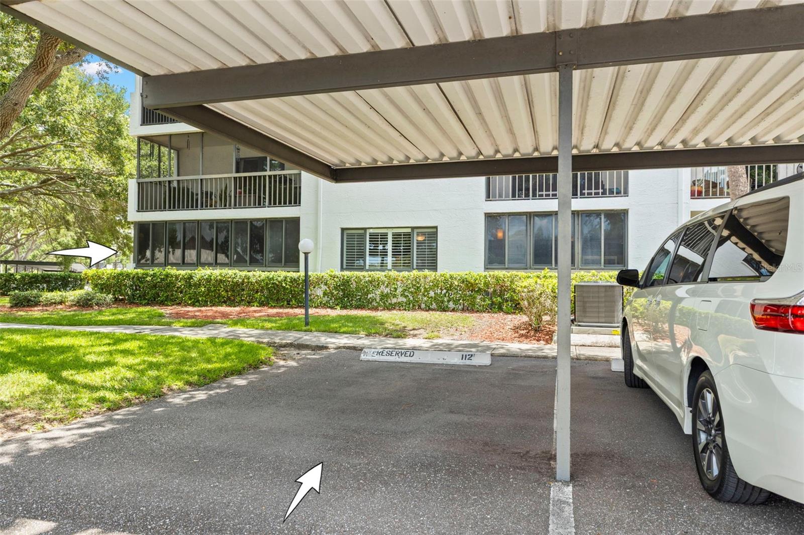 The assigned covered carport offers convenient parking and protection from the Florida sun and rain.