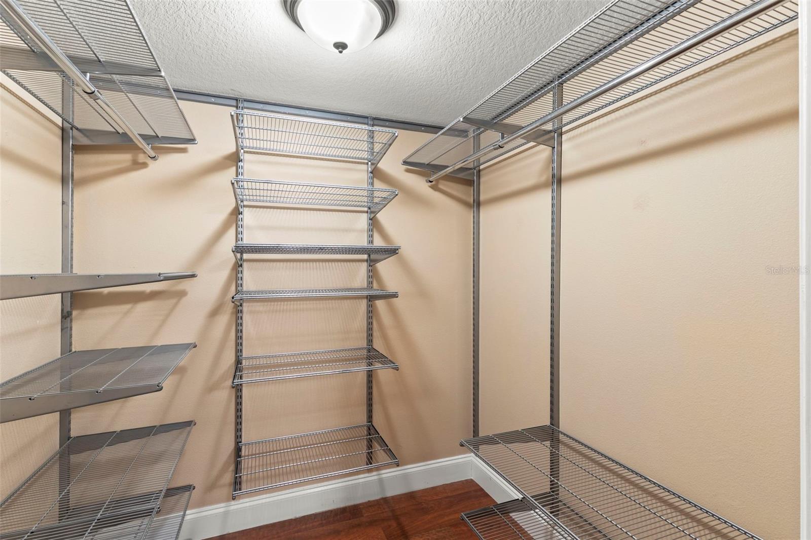 2 bedroom Walk-in closet with customizable wire shelving provides abundant storage and organization space