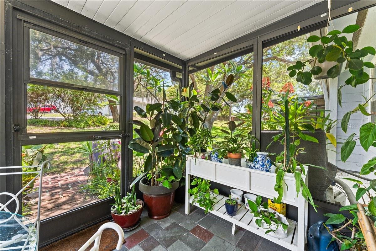 Screened porch with access to back garden
