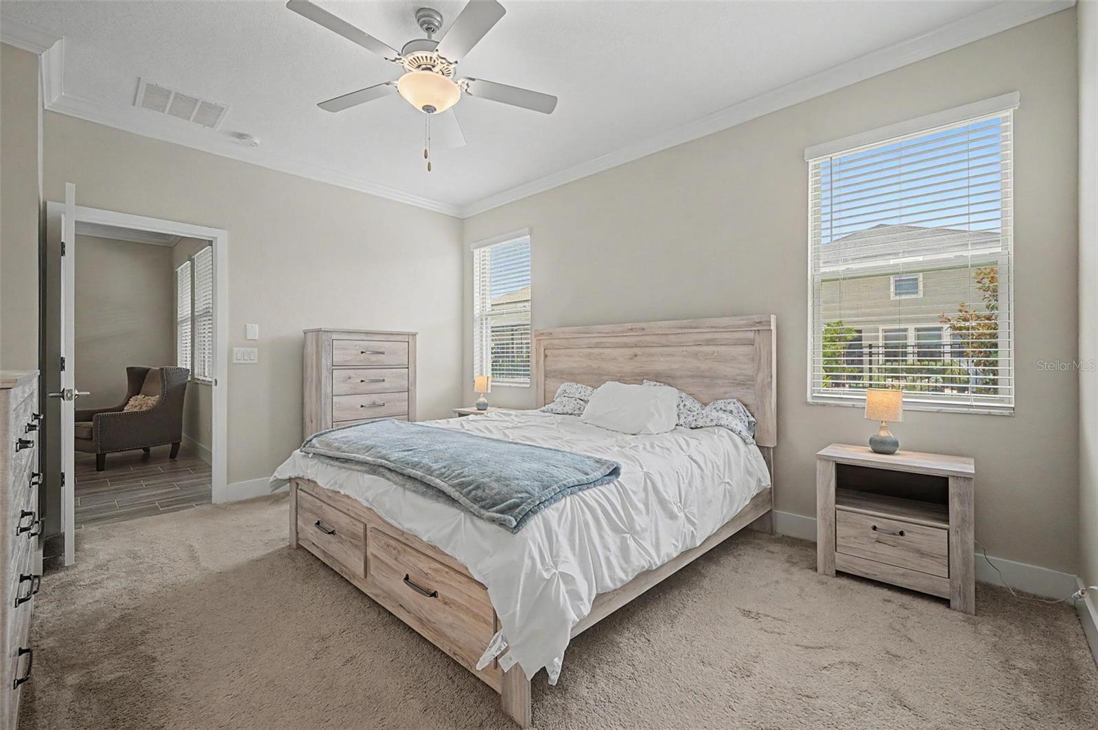 Primary bedroom also with crown molding