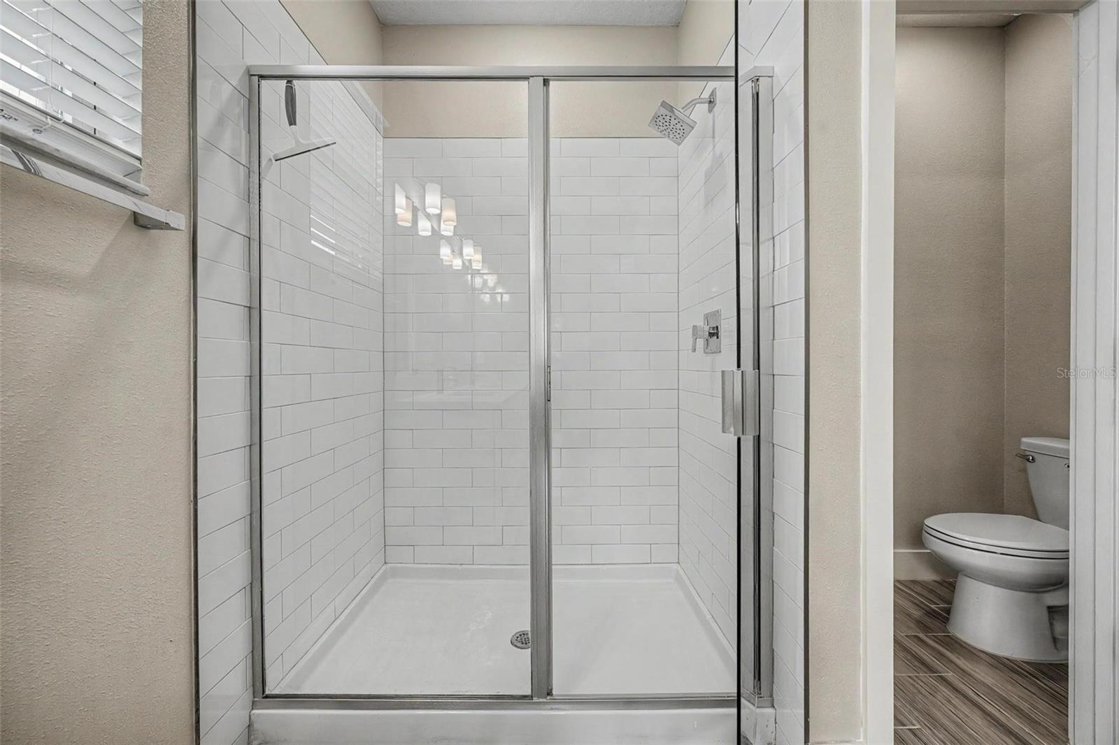 Oversized shower and water closet to the right