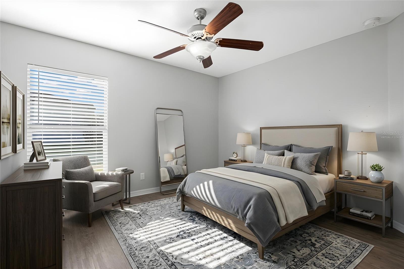 Bedroom 3 features laminate flooring, a ceiling fan, neutral tones, natural light, and a built-in closet.