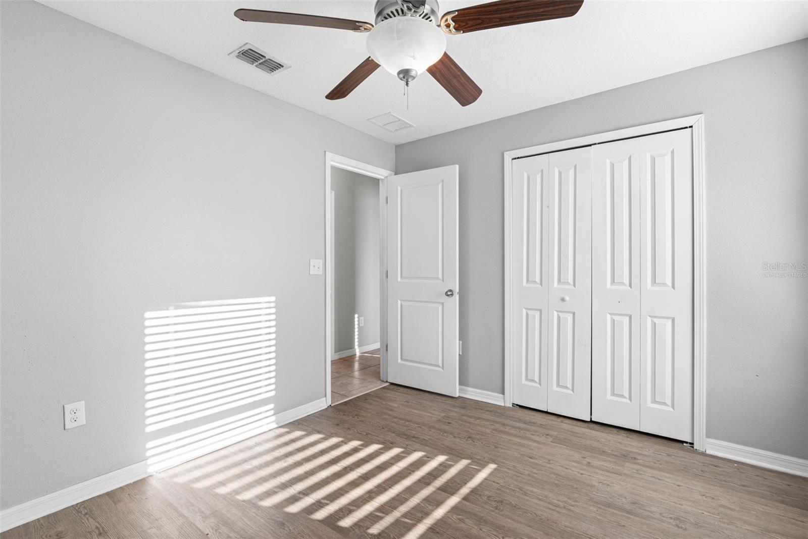 Virtually staged to demonstrate the room’s size and potential furniture arrangement.