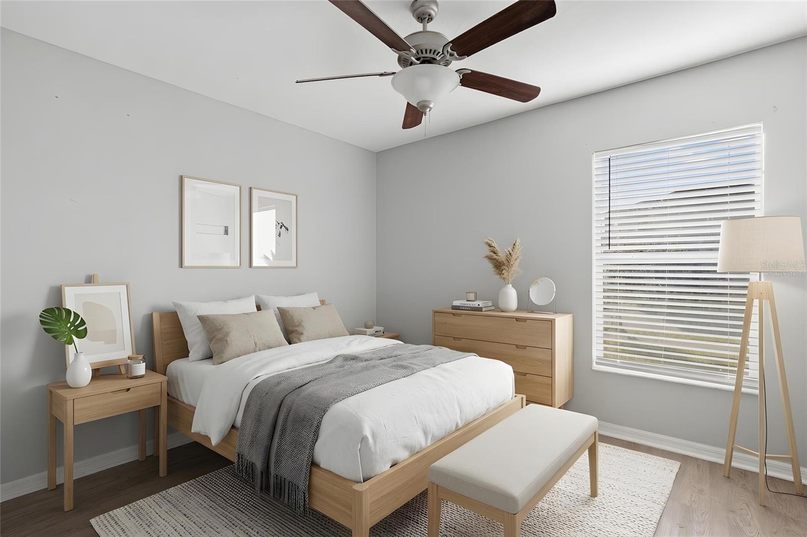 Bedroom 4 features laminate flooring, a ceiling fan, neutral tones, natural light, and a built-in closet.
