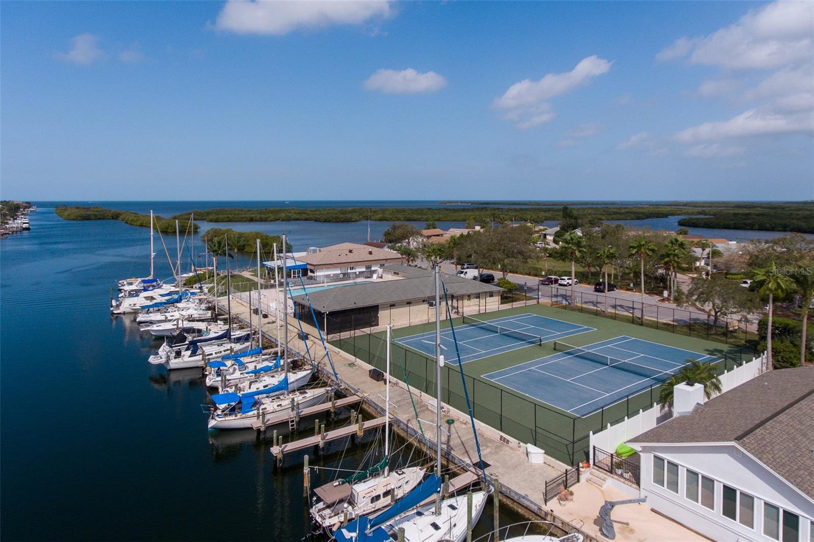 The ultimate costal lifestyle in Gulf Harbors Woodlands, featuring community tennis court, a heated pool and access to boats slips through the yacht club.