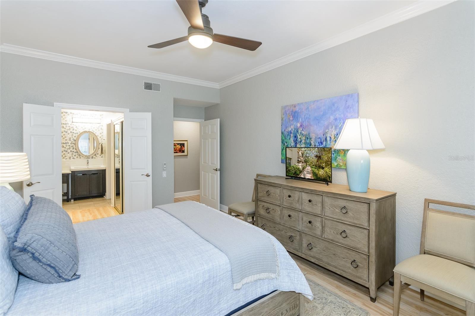 Primary bedroom with french doors to your en-suite bathroom.