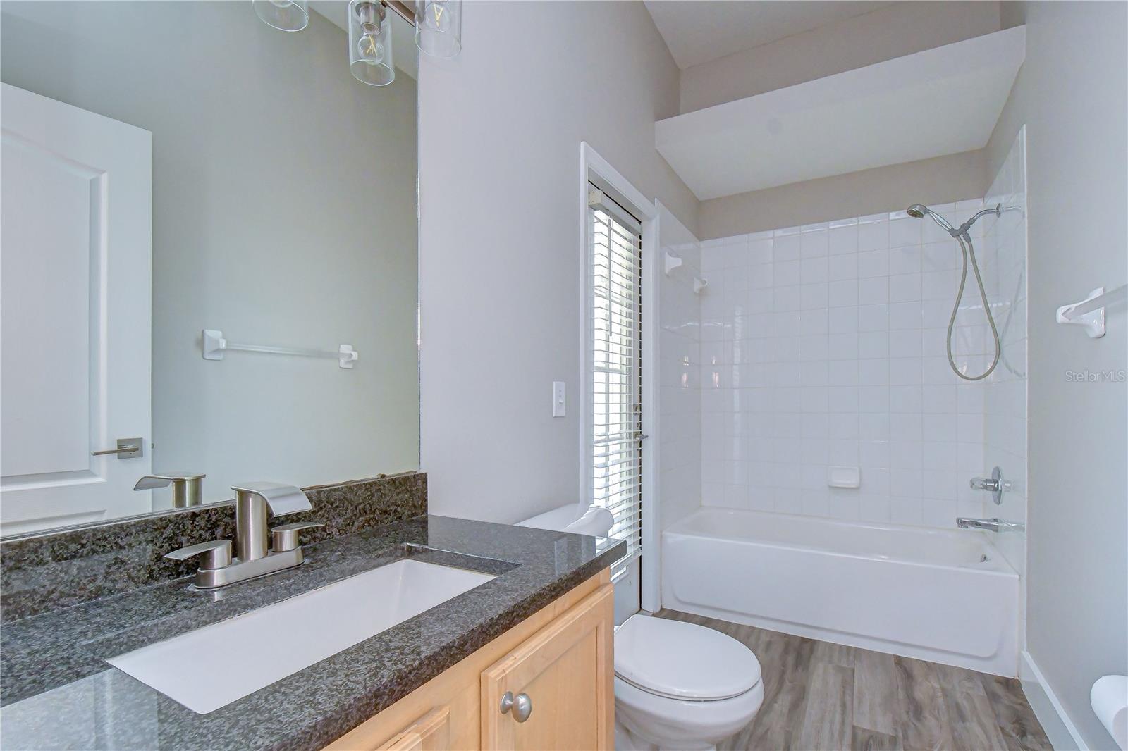 Full bathroom conveniently located between secondary bedrooms.