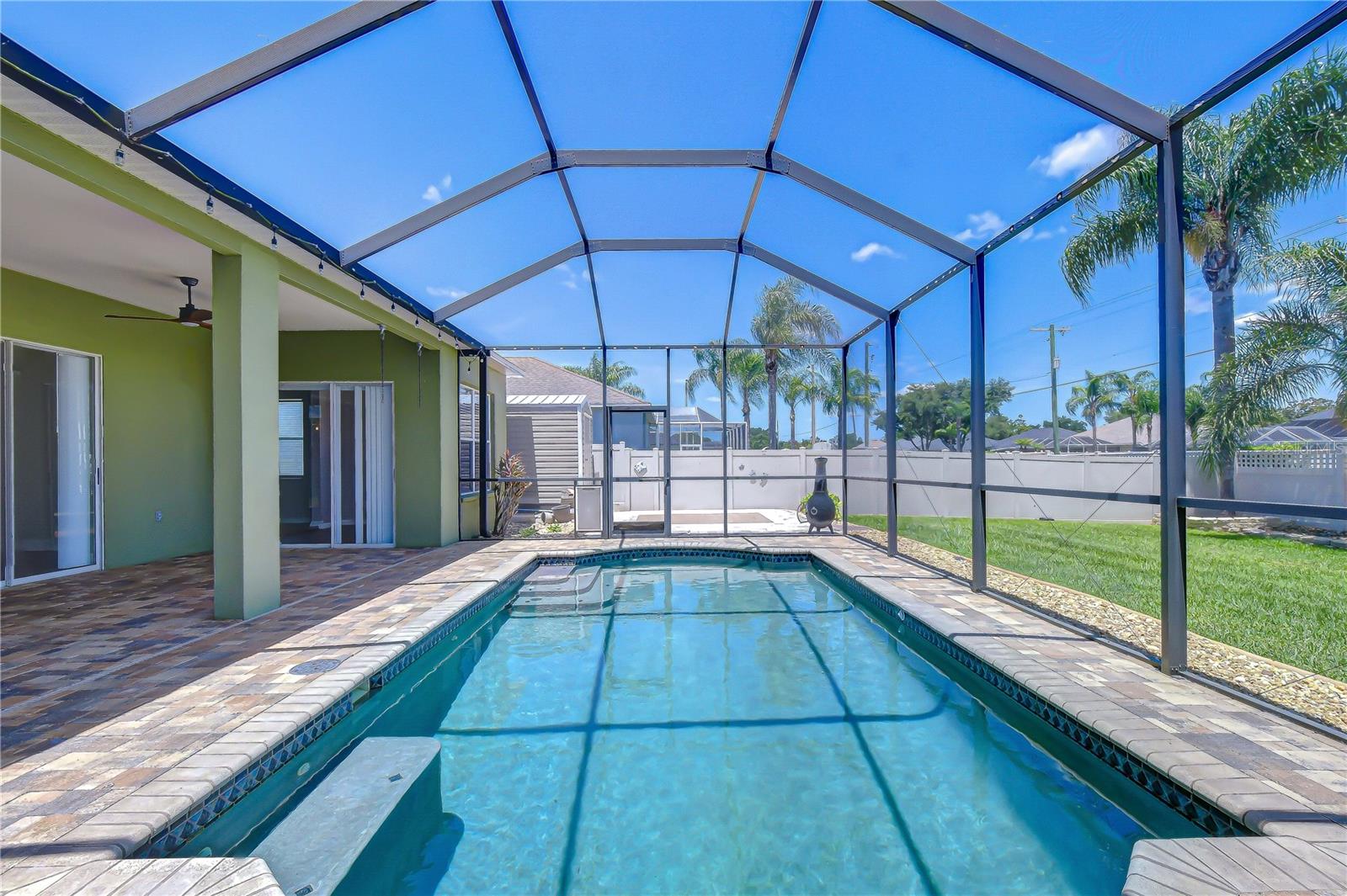 Stunning PebbleTec® pool with custom waterline tile.
