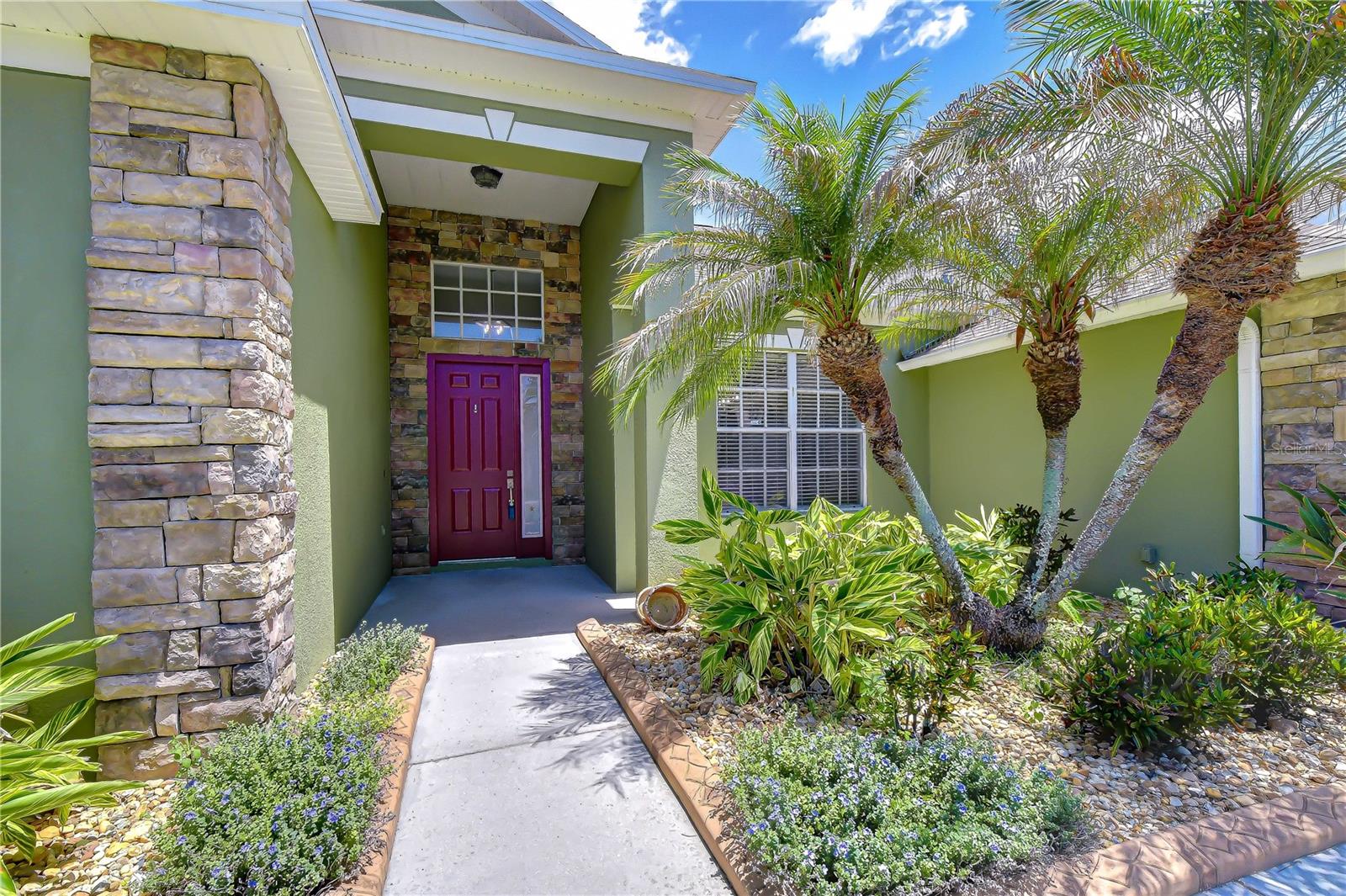 Mature landscaping enhances the home’s curb appeal.