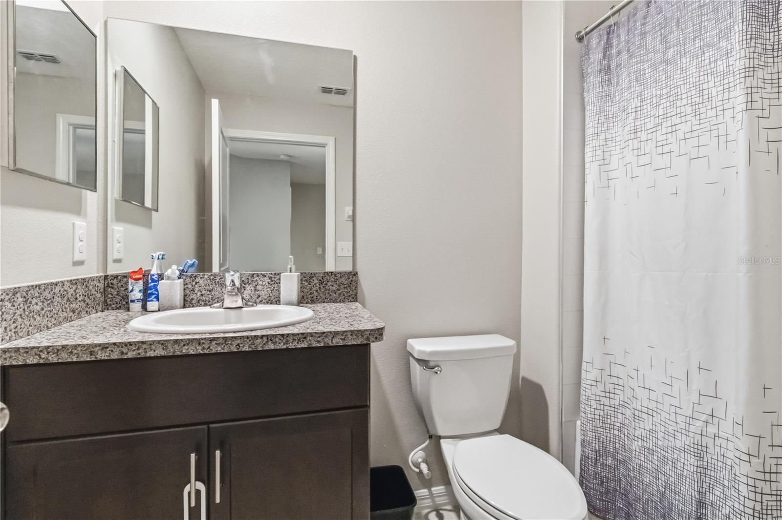 Full bathroom with tub shower