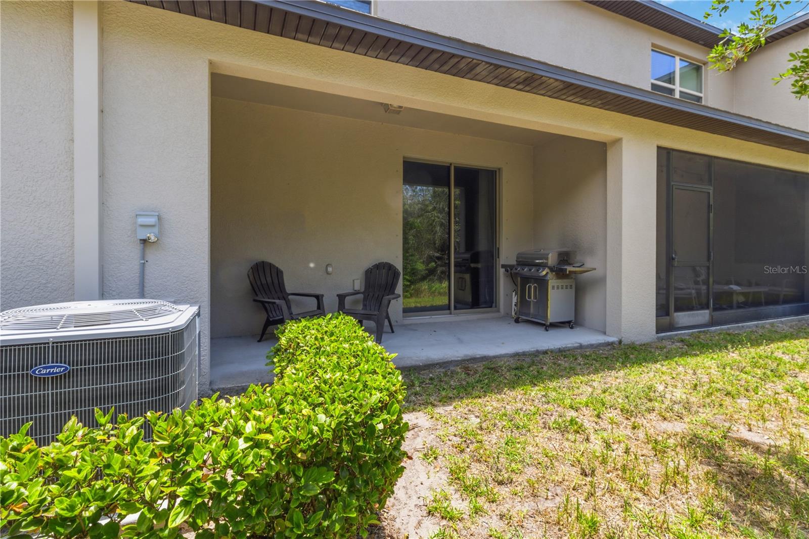 Covered patio backing to green space