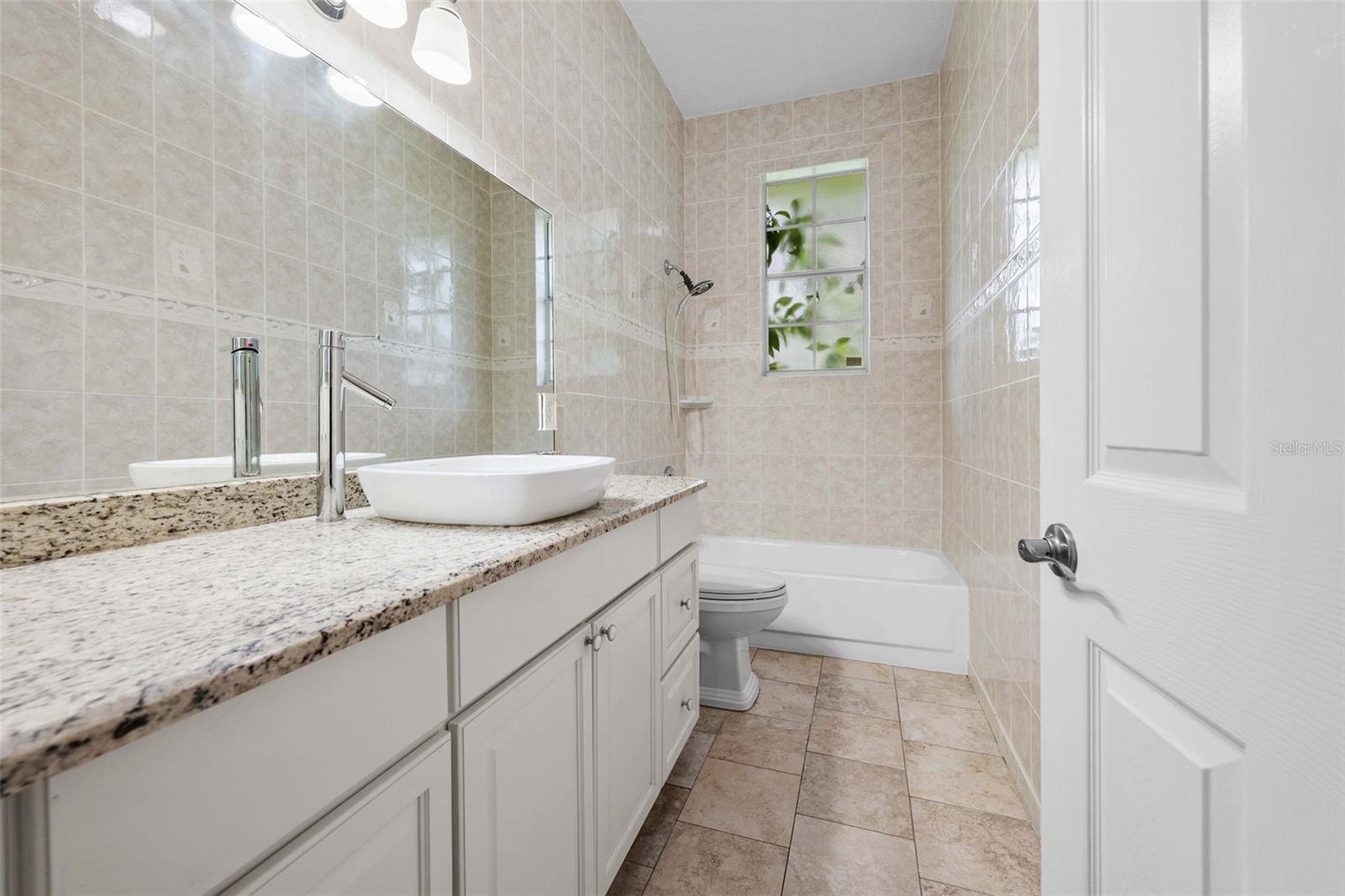 guest bath off kitchen and dining area