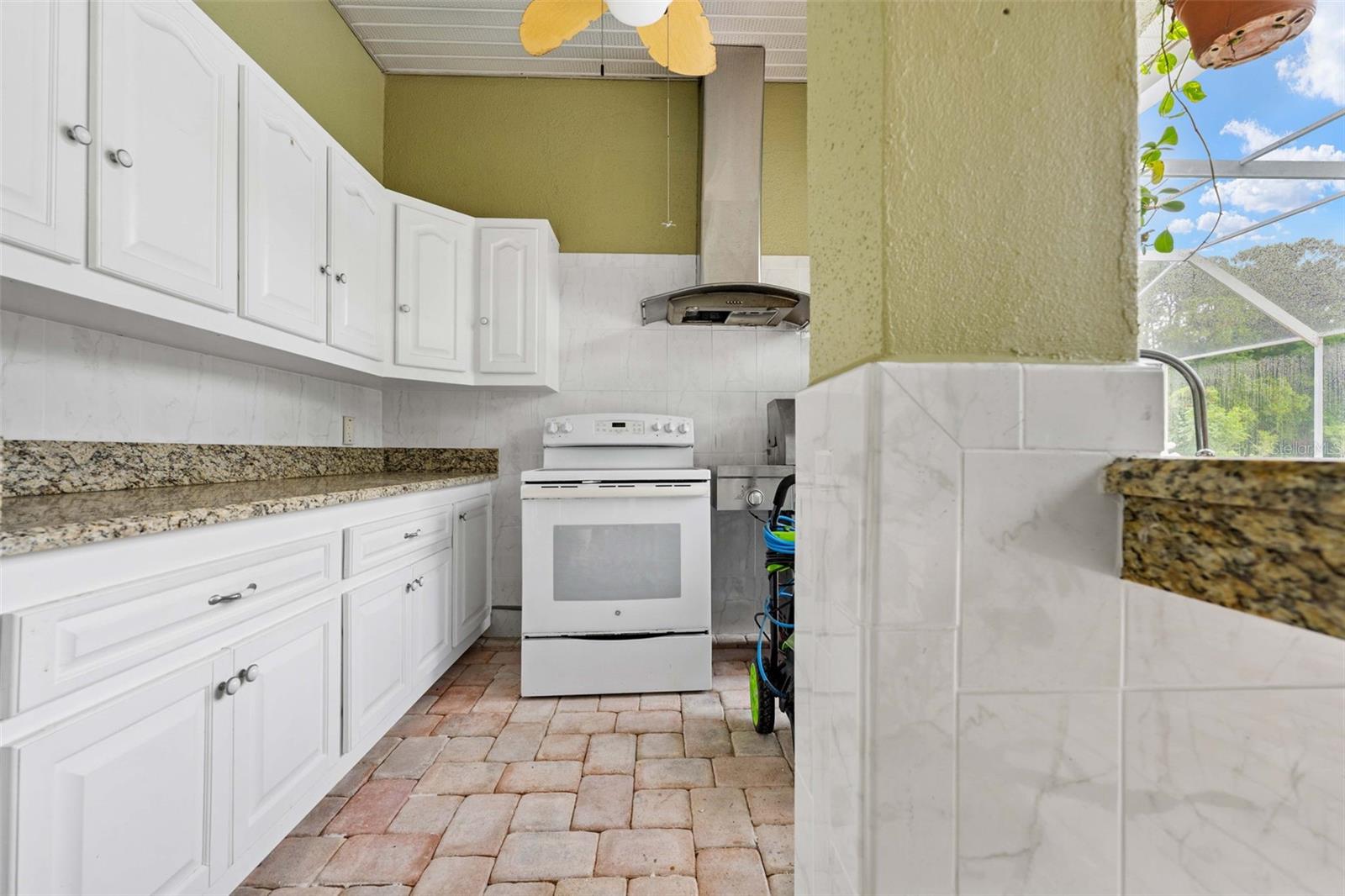 outdoor kitchen light and fan and stainless steel range hood