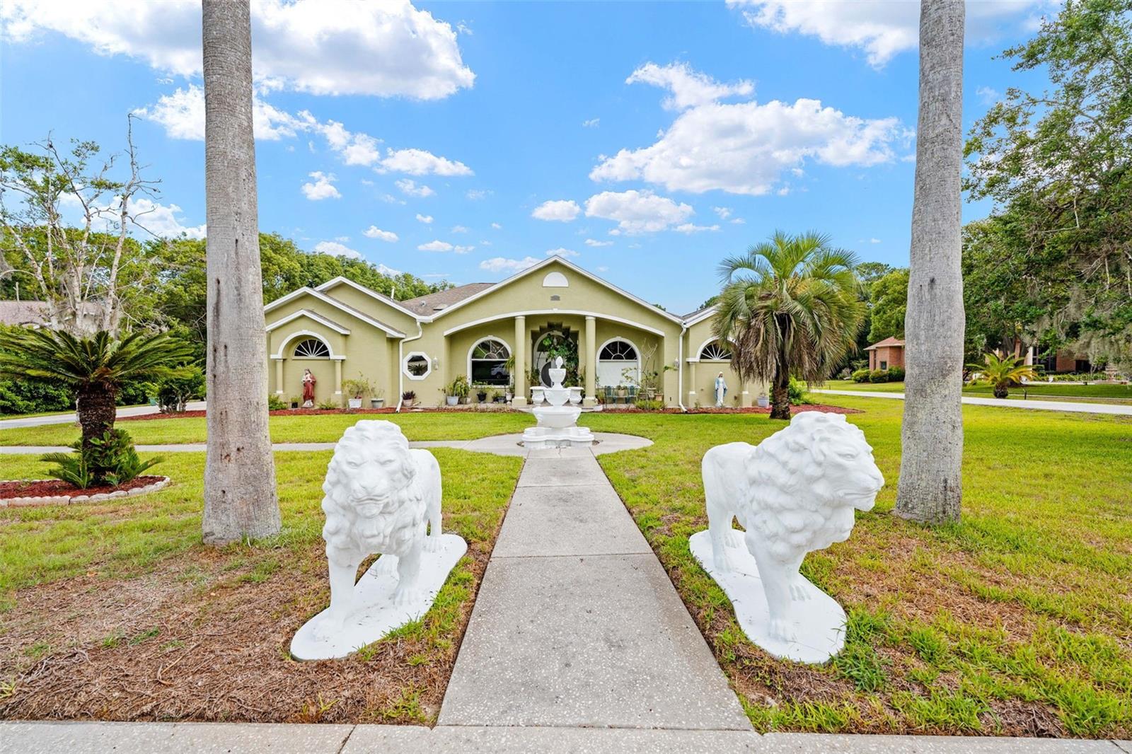 flanked gatekeeper lions greet guests