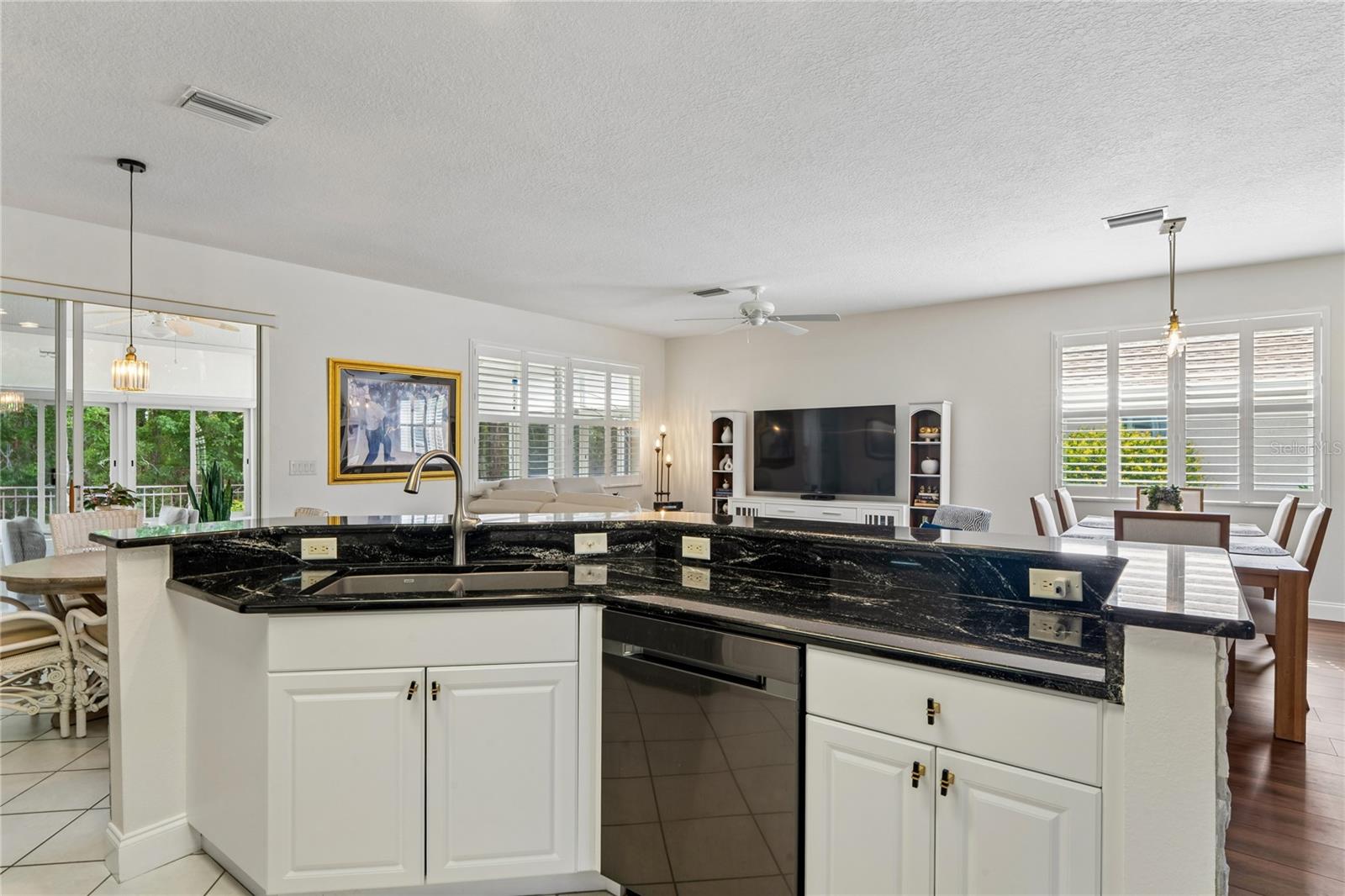 CONVENIENT SINK IN THE BAR ISLAND.  BEAUTIFUL. GRANITE COUNTERTOPS IN KITCHEN AND BATHS