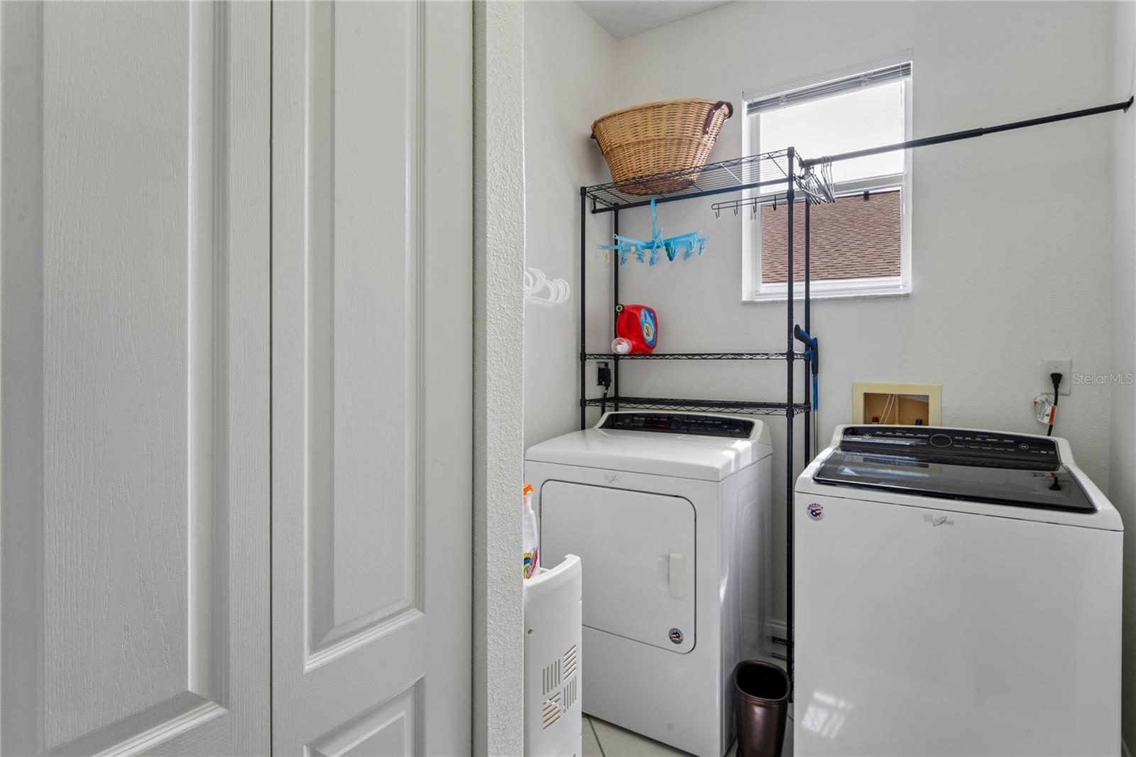 WELL DESIGNED LAUNDRY ROOM WITH LARGE STORAGE CLOSET IS LOCATED OFF LIVING AREA