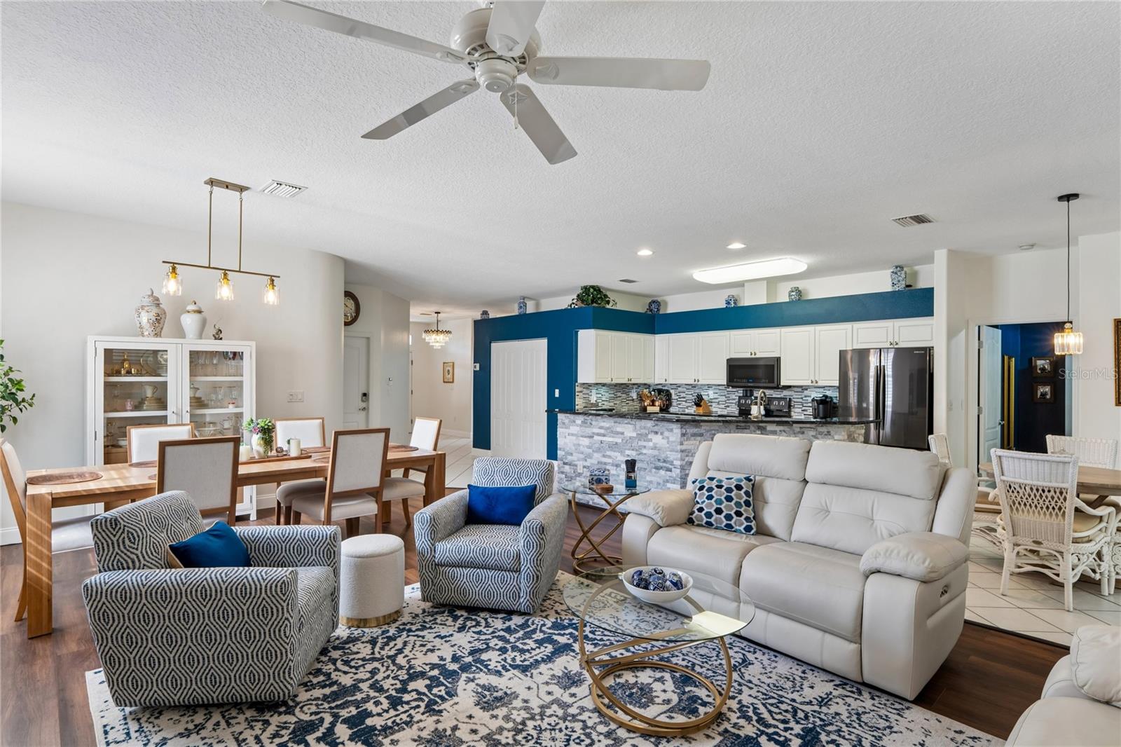 CEILING FANS AND DECORATOR LIGHTING THROUGHOUT THE HOME.  LUXURY VINYL AND TILED FLOORS PROVIDE FOR EASY CLEANING AND REDUCED ALLERGINS.