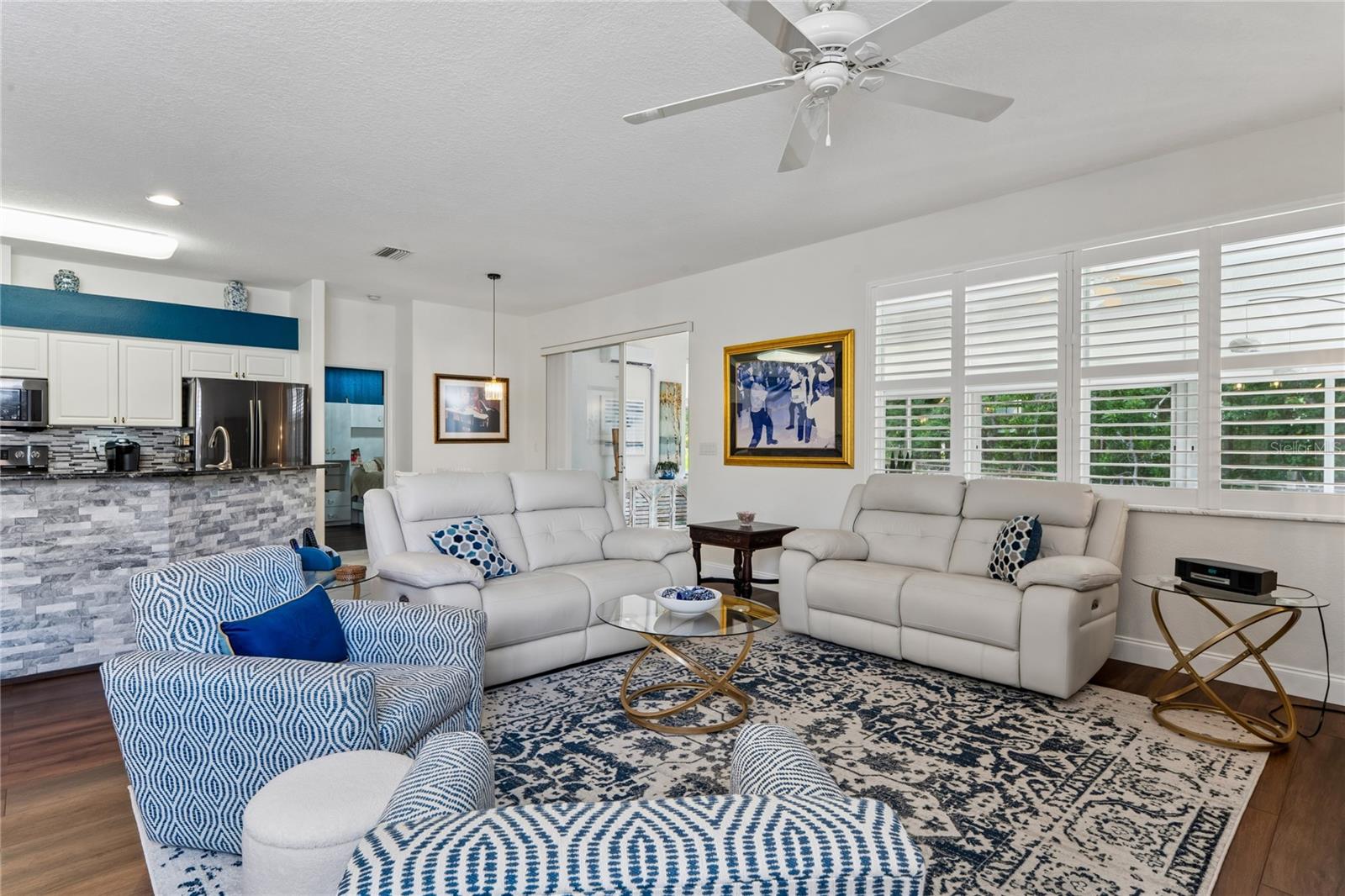 NATURAL LIGHTING ABOUNDS IN LIVING AREA