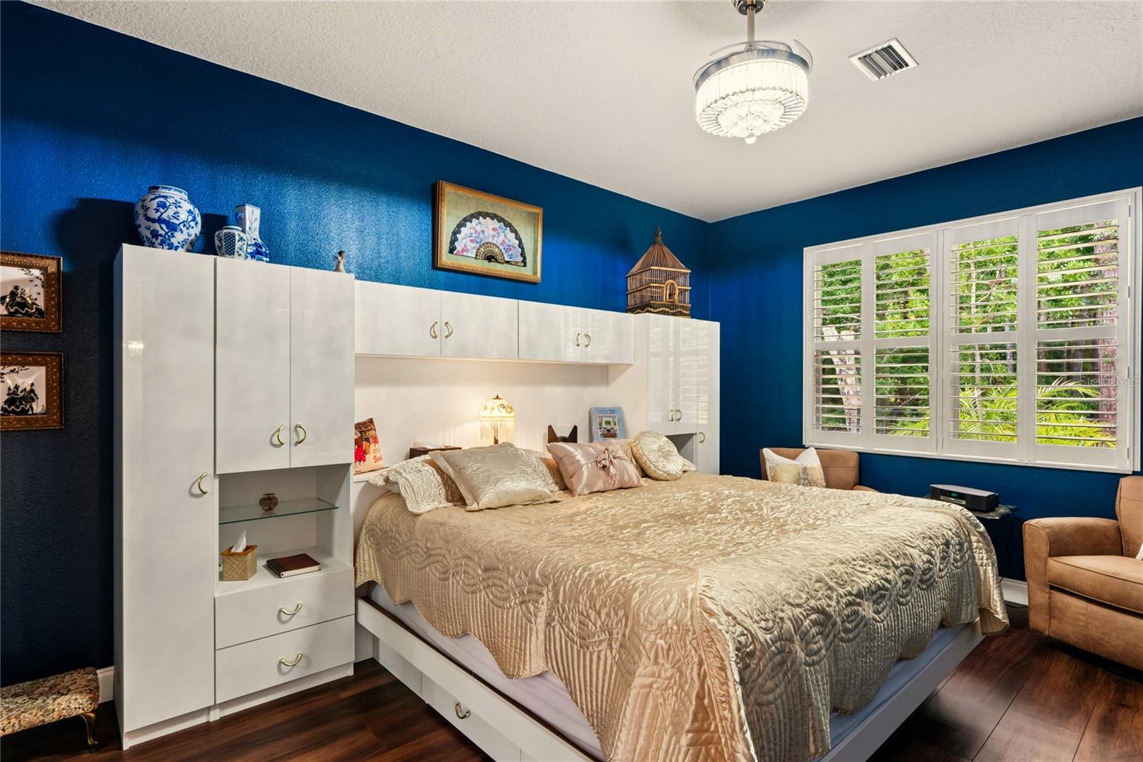 MASTER BEDROOM WITH KINGSIZED WALL UNIT BED TO BE SOLD WITH HOME.  PROVIDES LOTS OF STORAGE AND ADDS ROOM SPACE.