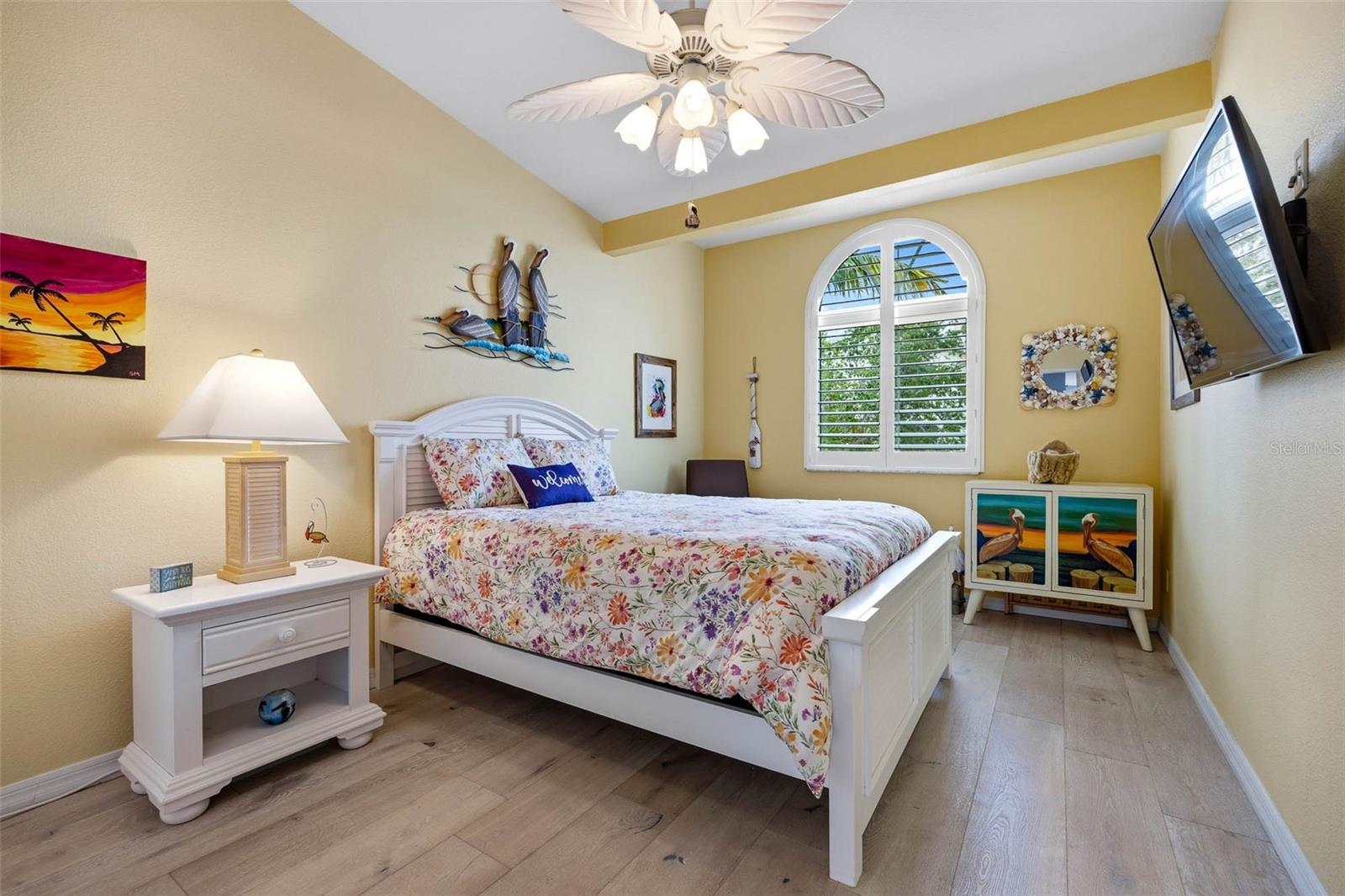 Main floor guest bedroom is spacious, light and bright with high ceilings