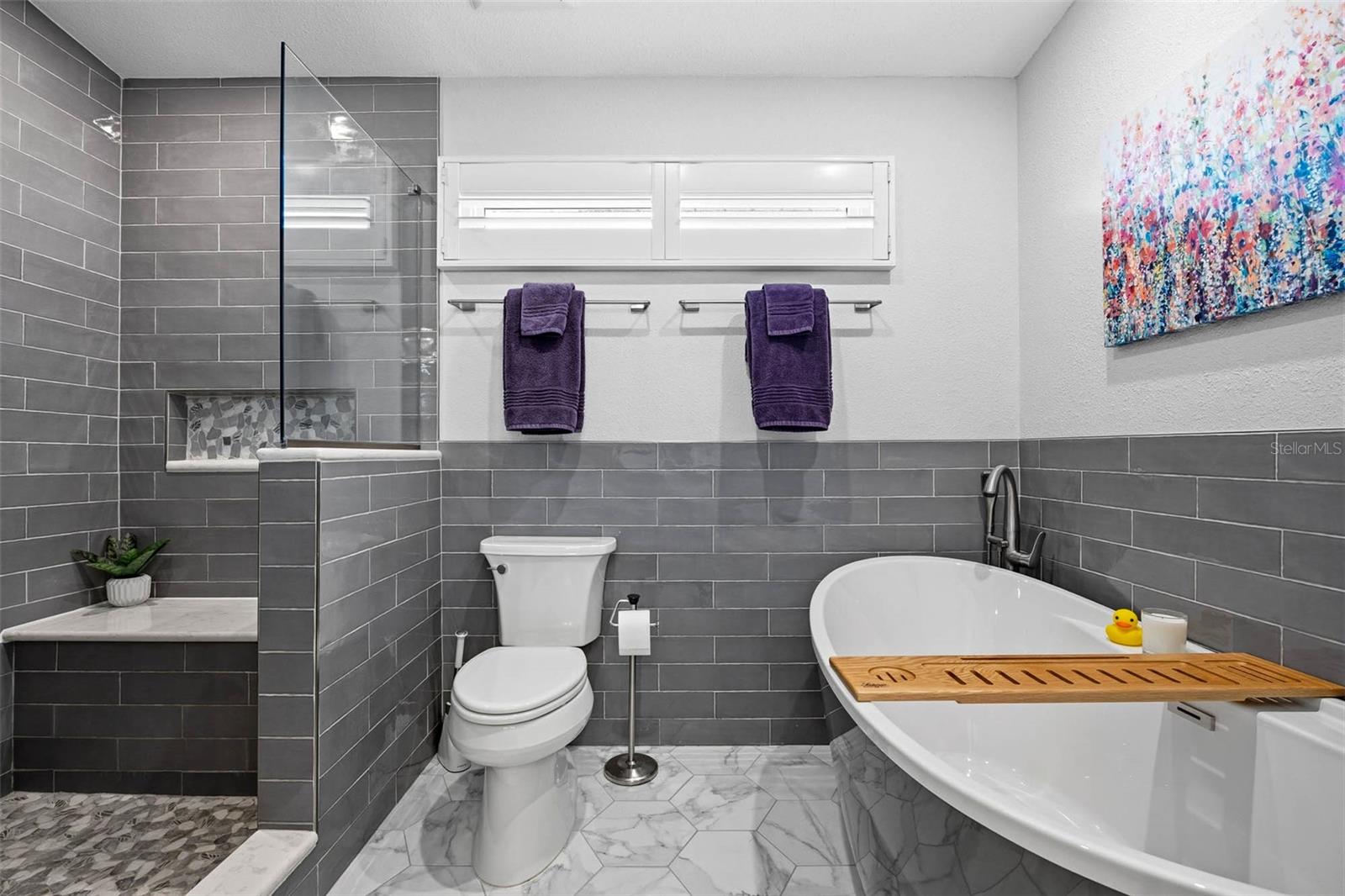 Relaxing soaker tub with hot water provided by the On Demand Water Heater that supports 8/5 GPM so you can be soaking in minutes!