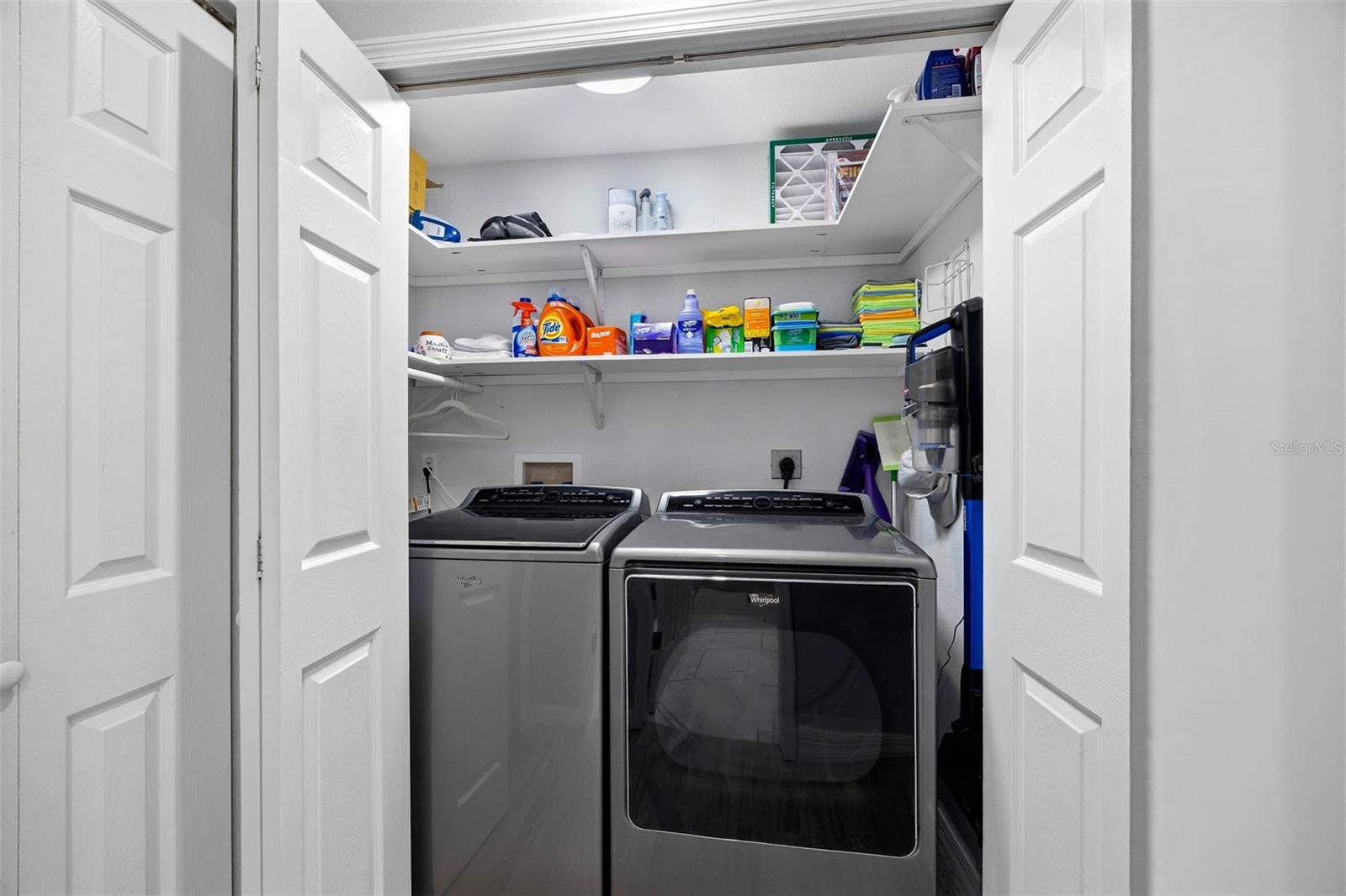 Laundry Closet with full size washer and dryer on main living level.