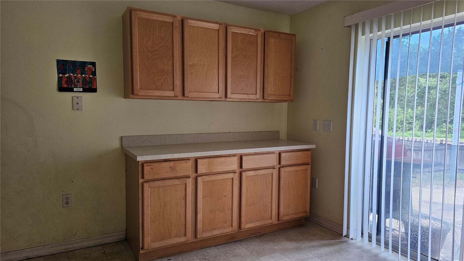kitchen with additional built in cabinets that were added after purchasing the home