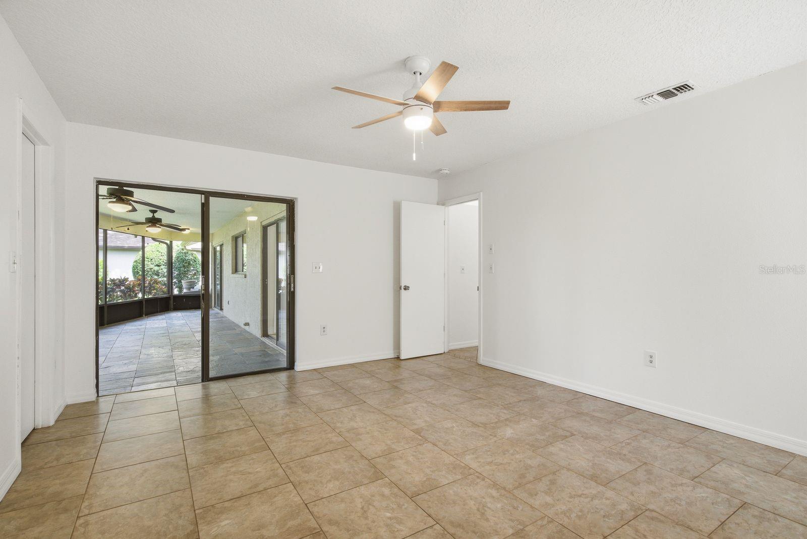 Primary bedroom, sliders to exterior patio